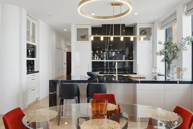 a dining room with furniture and wooden floor