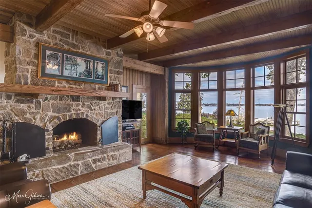 a living room with furniture a window and a fireplace