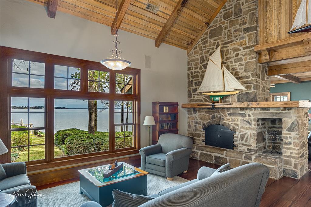3045 Risinger Drive Shreveport, LA 71119 - Photo 13 of 40 a living room with furniture a fireplace and windows