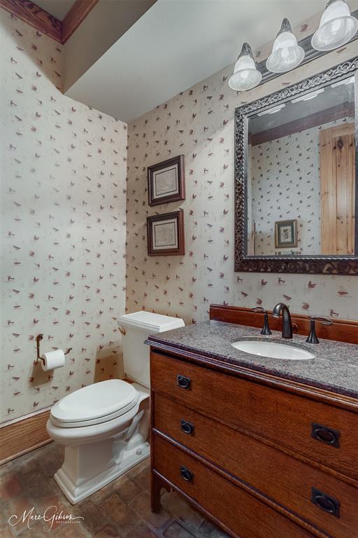 3045 Risinger Drive Shreveport, LA 71119 - Photo 26 of 40 a bathroom with a granite countertop toilet sink mirror and vanity