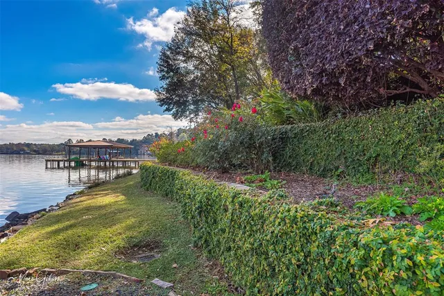 a living room with furniture a fireplace and windows