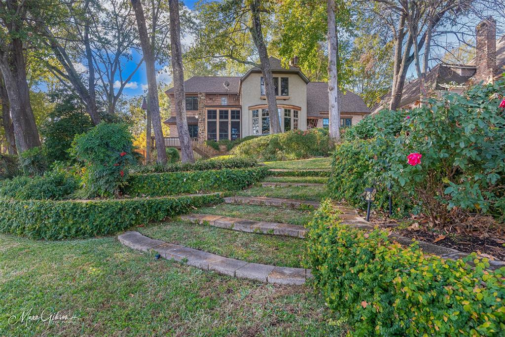 3045 Risinger Drive Shreveport, LA 71119 - Photo 10 of 40 a front view of a house with a yard and large trees