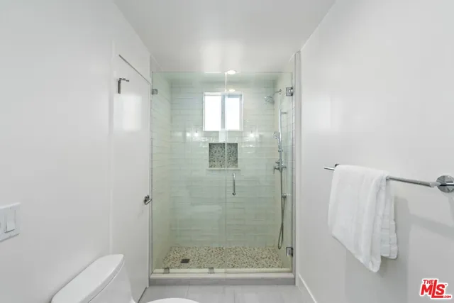 a bathroom with a shower and bathtub