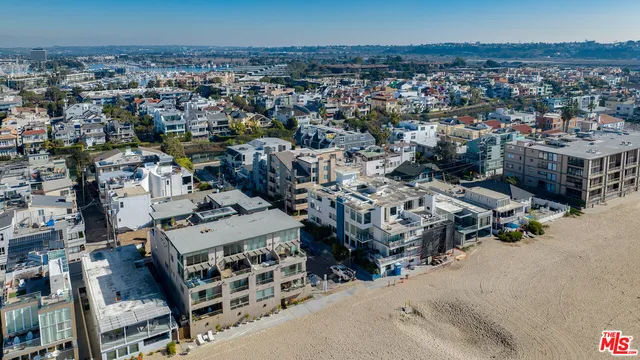 a view of a building with potted plants
