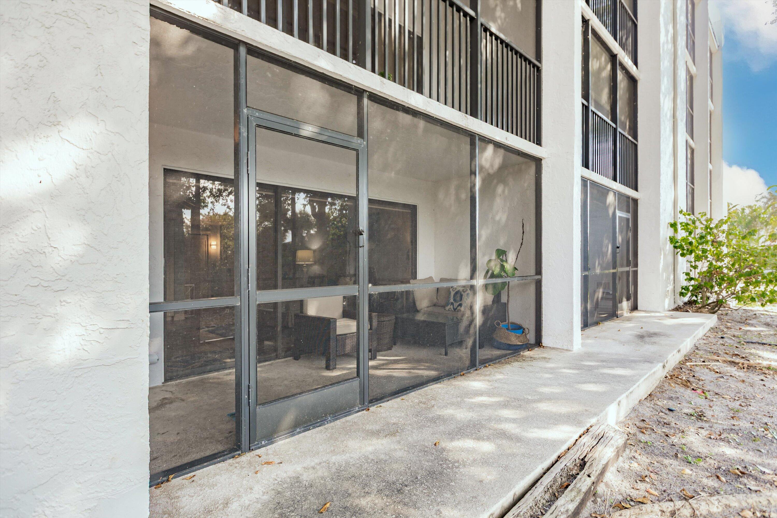 1605 Highway 1, Unit C104 Jupiter, FL 33477 - Photo 15 of 24 1605 US Highway 1 C104 enclosed porch