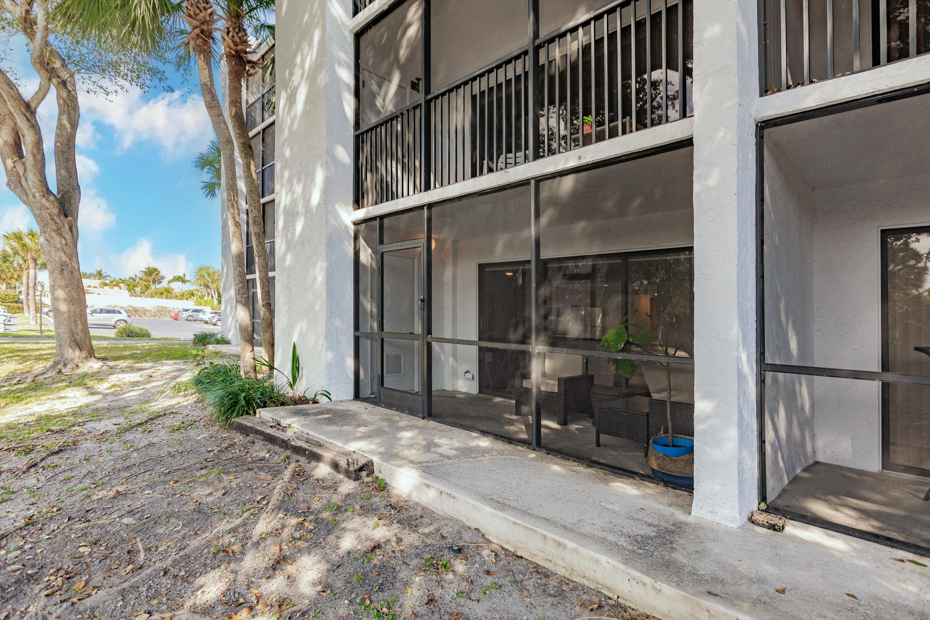 1605 Highway 1, Unit C104 Jupiter, FL 33477 - Photo 17 of 24 1605 US Highway 1 C104 screened porch 2