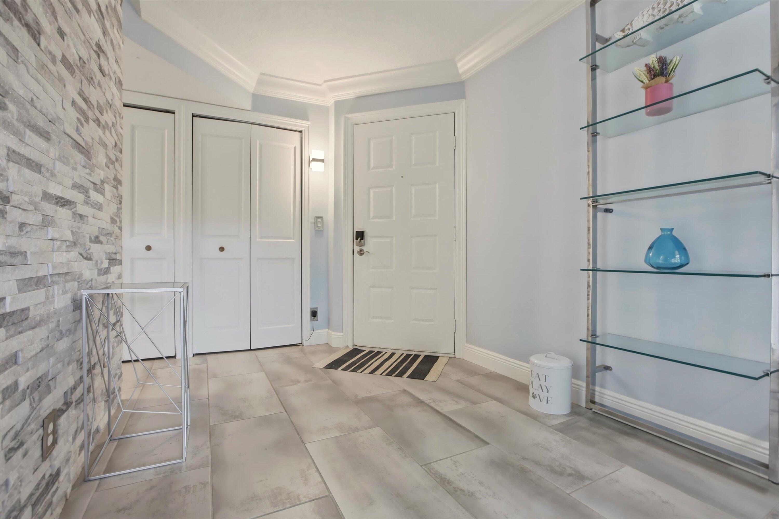 1605 Highway 1, Unit C104 Jupiter, FL 33477 - Photo 3 of 24 1605 US Highway 1 C104 foyer