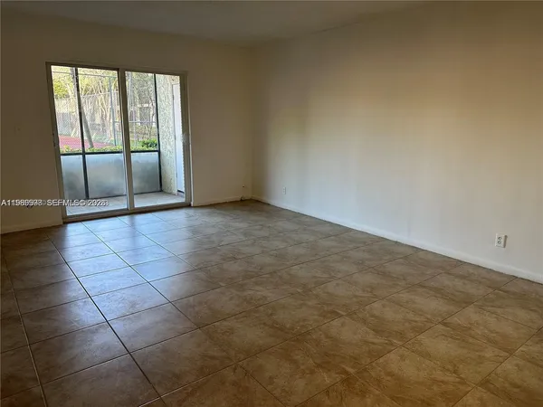 a view of an empty room and window