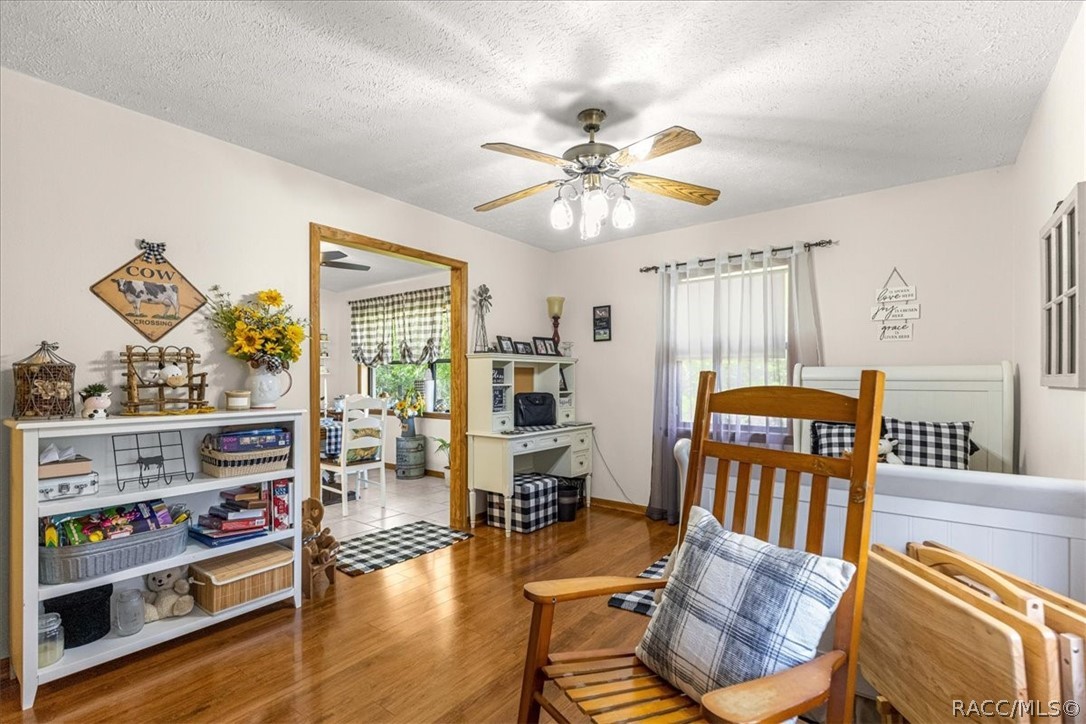 2964 South Cygnet Terrace Inverness, FL 34450 - Photo 36 of 67 a view of a livingroom with furniture hardwood floor and a ceiling fan