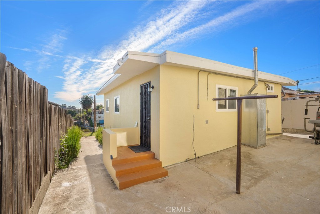 3261 Eagle Street Los Angeles, CA 90063 - Photo 4 of 40 a view of a porch with furniture and a yard