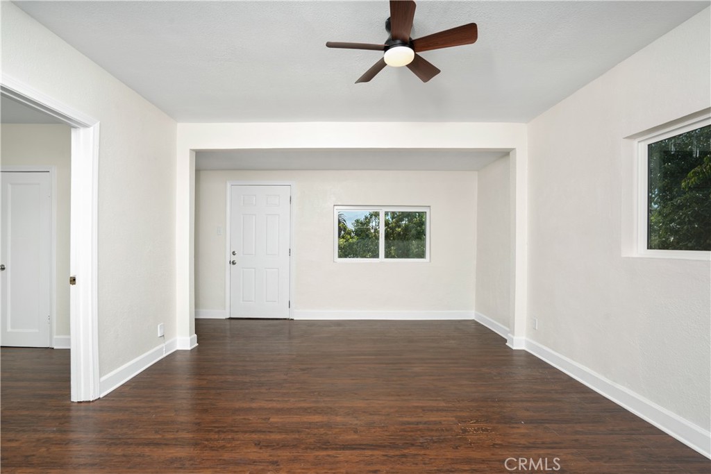 3261 Eagle Street Los Angeles, CA 90063 - Photo 5 of 40 a view of empty room with wooden floor and fan
