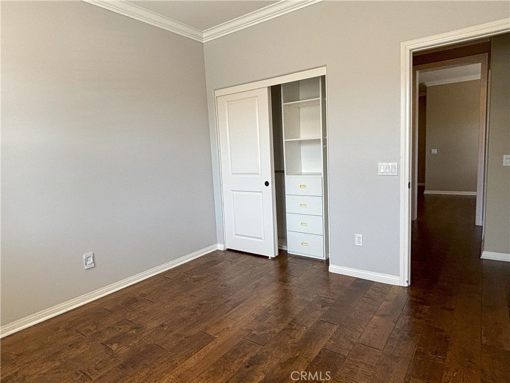 25 Bridge Trail Irvine, CA 92618 - Photo 13 of 25 an empty room with wooden floor and closet