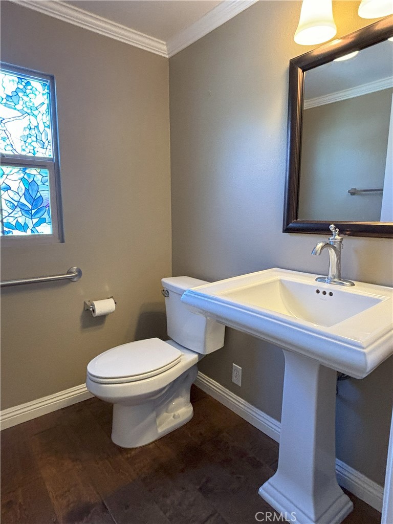 25 Bridge Trail Irvine, CA 92618 - Photo 16 of 25 a bathroom with a sink a toilet and mirror