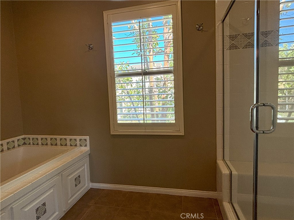 25 Bridge Trail Irvine, CA 92618 - Photo 10 of 25 a bathroom with a bathtub and shower