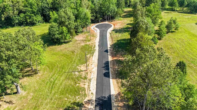 a swimming pool with green space
