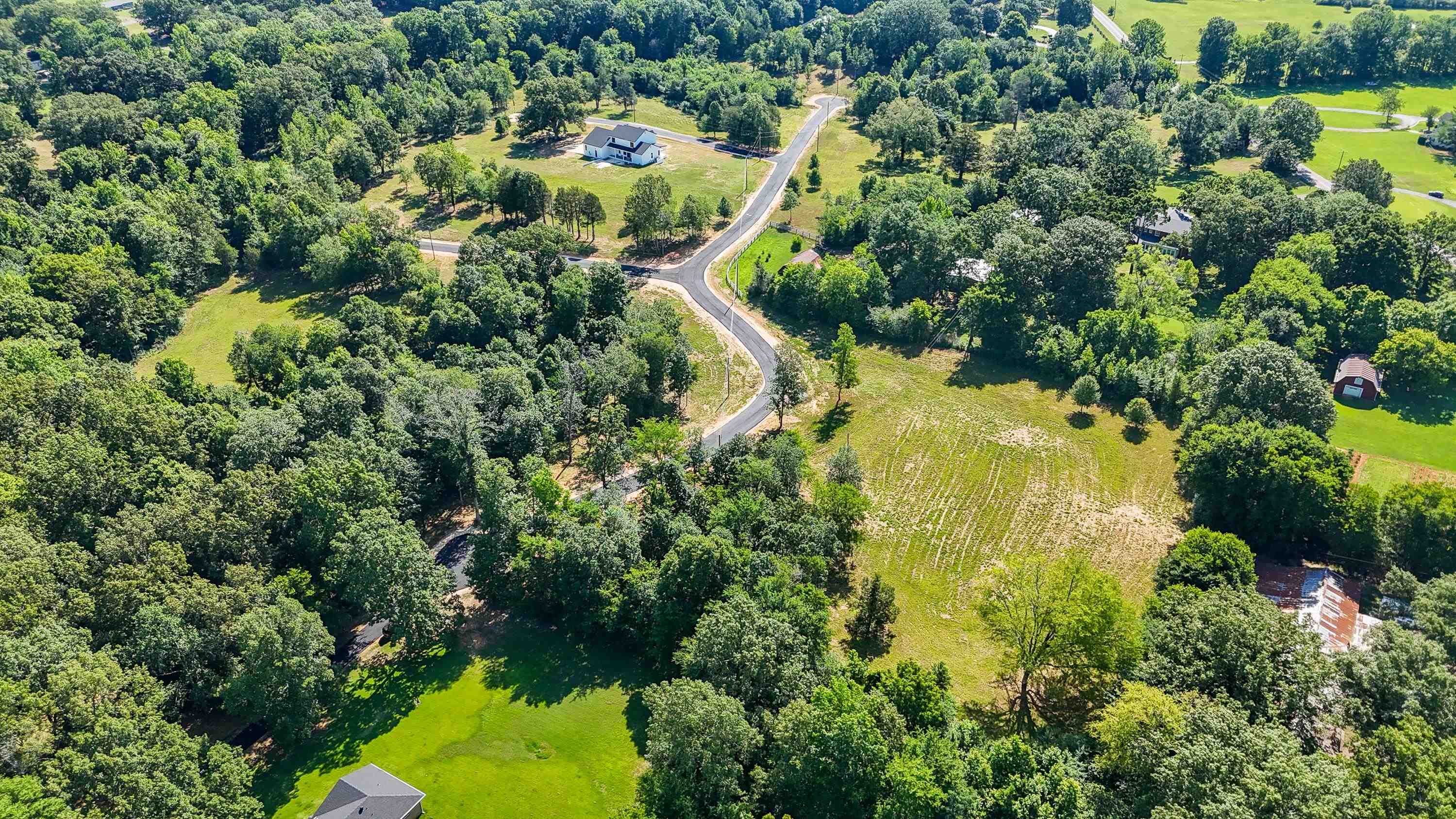 0 Grove Lane Savannah, TN 38372 - Photo 17 of 37 an aerial view of residential houses with outdoor space and trees all around