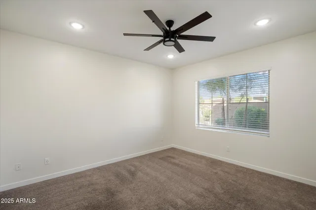a kitchen with a sink a counter top space and stainless steel appliances