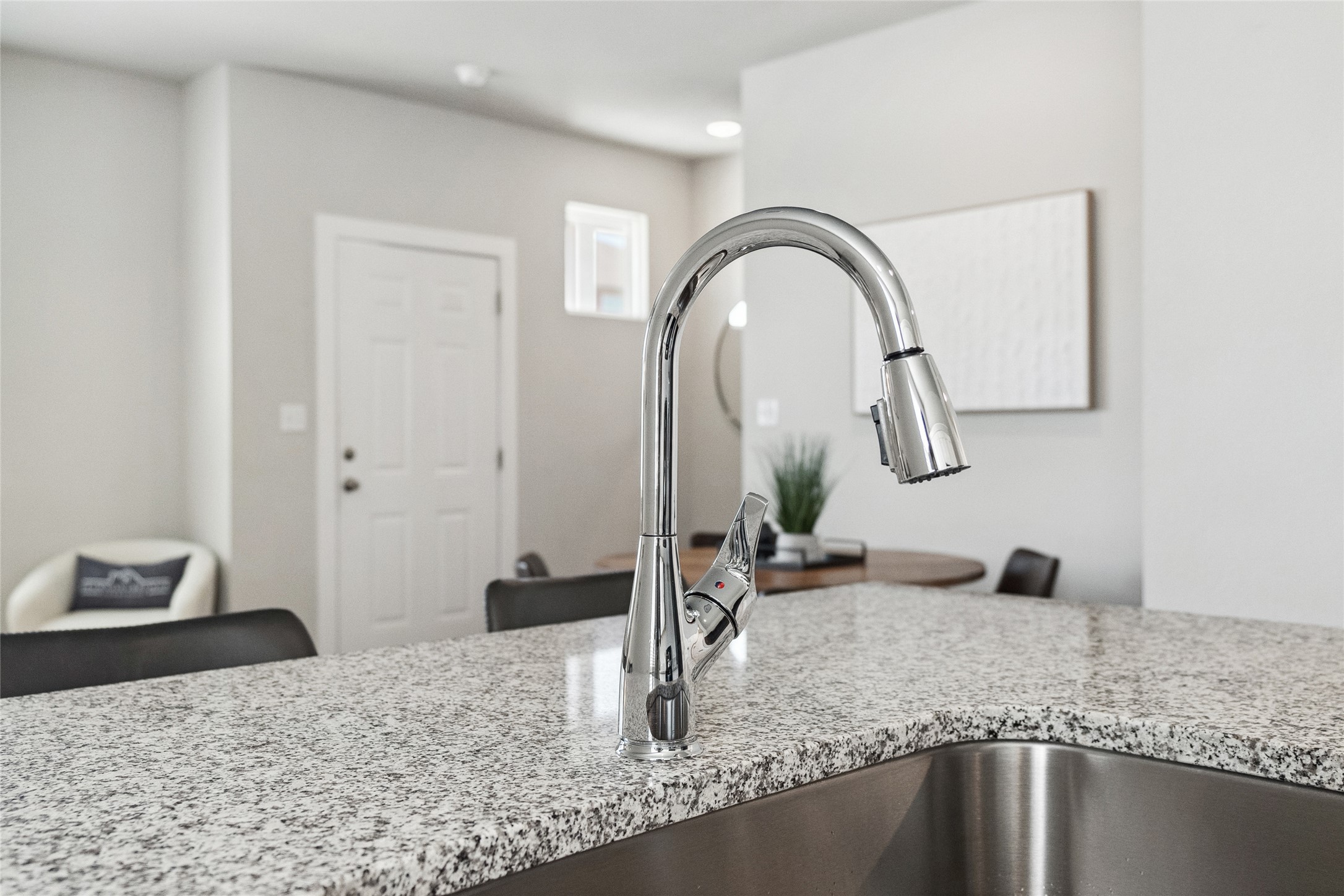 523 Powell Drive, Unit 1101 Leander, TX 78641 - Photo 10 of 24 Kitchen view of light stone counters and a sink
