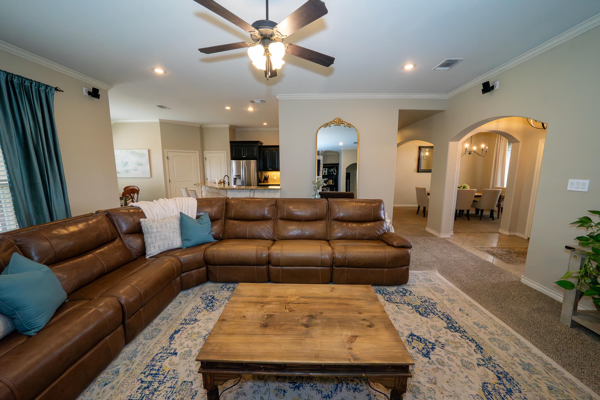 3301 County Road 7560 Lubbock, TX 79423 - Photo 8 of 40 a living room with furniture and a large window
