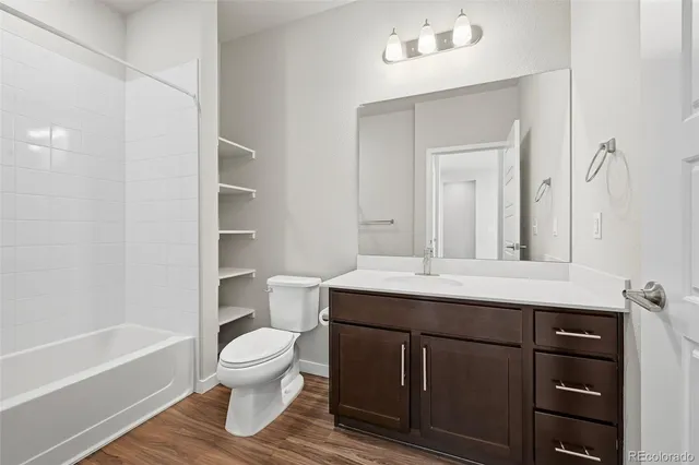 a bathroom with a sink a toilet and a bathtub