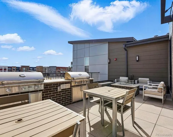 a view of a dinning tables and chairs in the terrace
