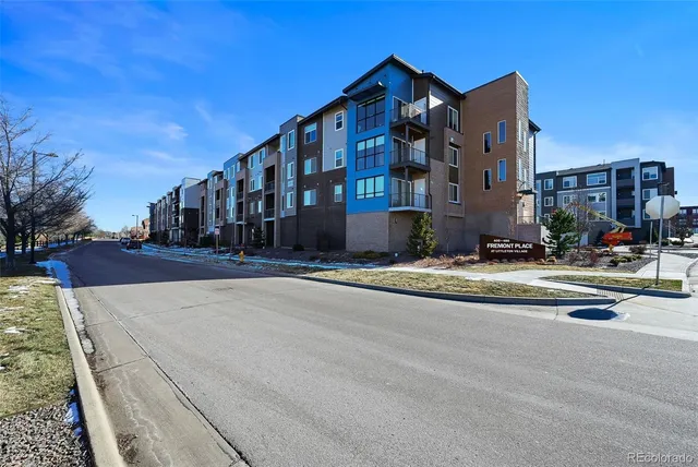 a view of street with large building