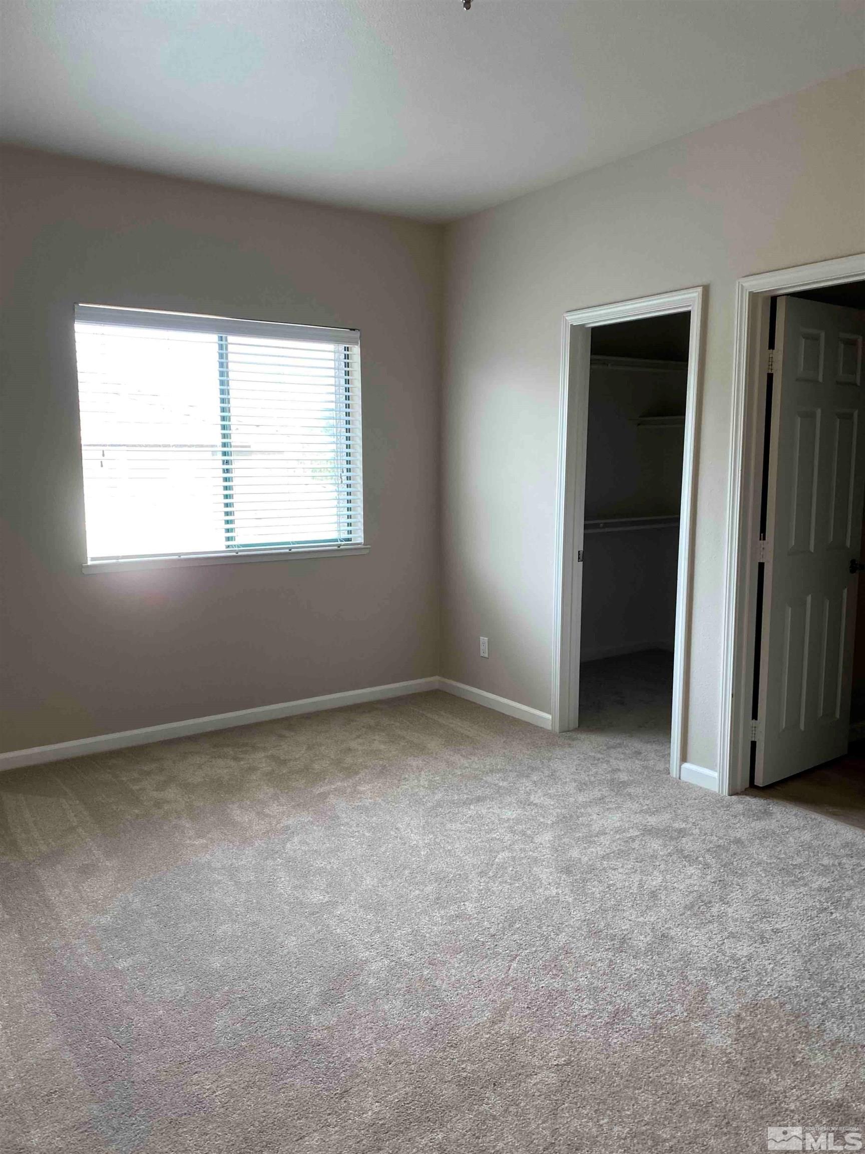 900 S Meadows, Unit 3722 Reno, NV 89521 - Photo 12 of 26 an empty room with windows
