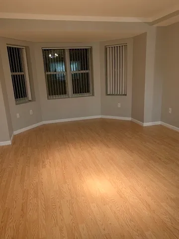 a view of an empty room with stairs