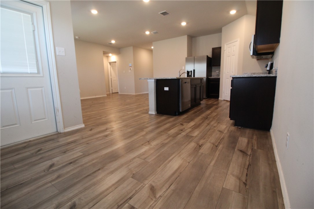 7009 Guadalupe Road China Spring, TX 76633 - Photo 5 of 20 a view of kitchen with wooden floor