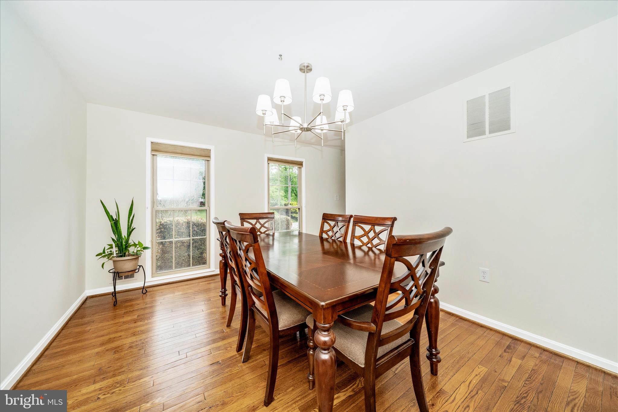 16000 Narrows Terrace Silver Spring, MD 20906 - Photo 6 of 54 a view of a dining room with furniture a chandelier and wooden floor