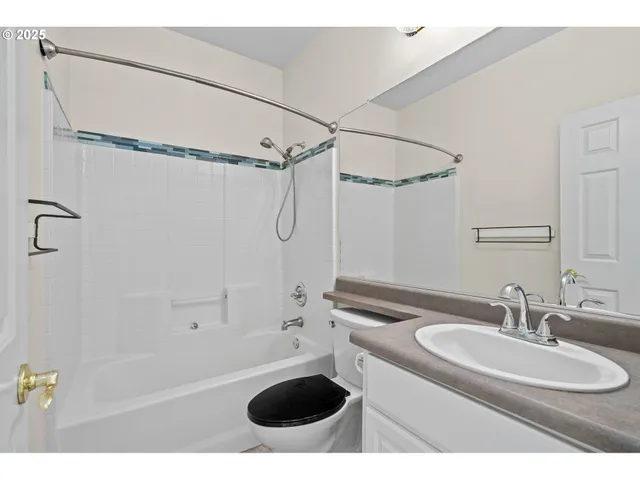 a bathroom with a sink double vanity and a shower