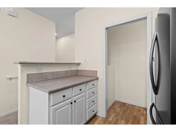 a kitchen with stainless steel appliances a refrigerator and a sink