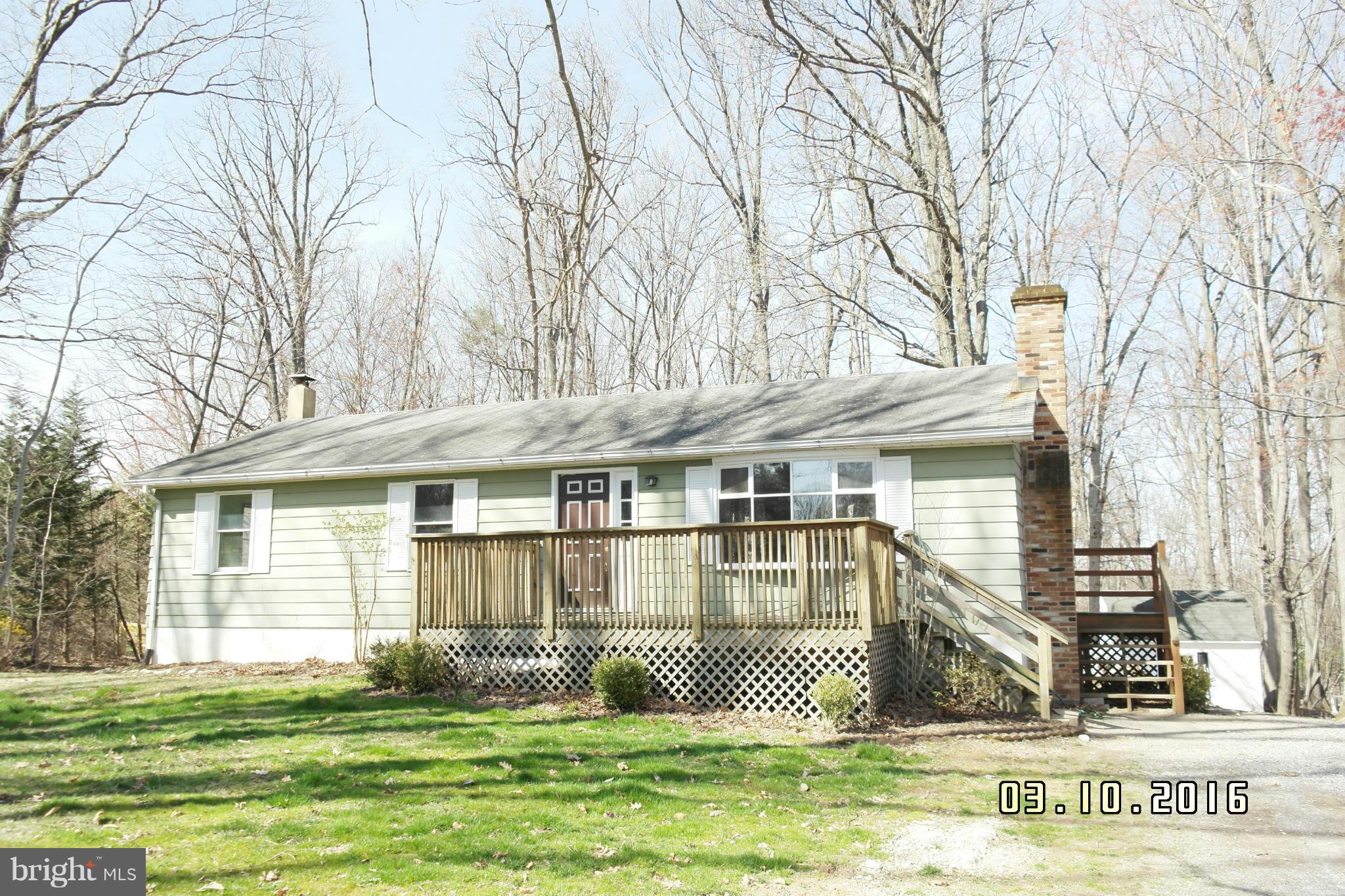 4524 Elmer Derr Road Frederick, MD 21703 - Photo 1 of 15 a front view of a house with a yard