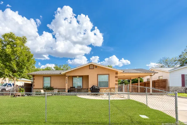 a front view of a house with swimming pool and furniture