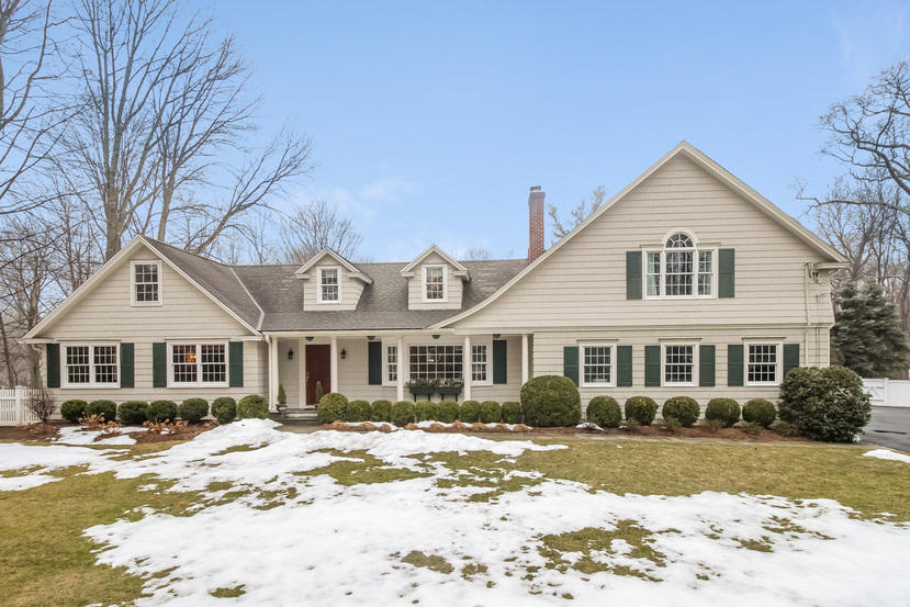 123 Brookside Road Darien, CT 06820 - Photo 1 of 39 a front view of a house with a yard