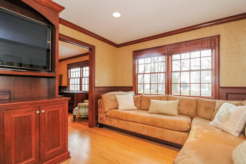 123 Brookside Road Darien, CT 06820 - Photo 14 of 39 a living room with furniture and a flat screen tv