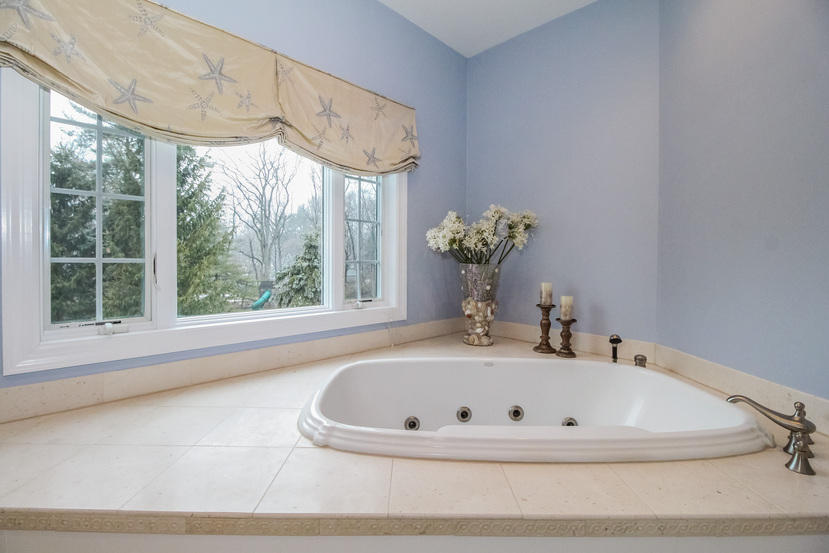 123 Brookside Road Darien, CT 06820 - Photo 22 of 39 a bathroom with a tub sink and mirror