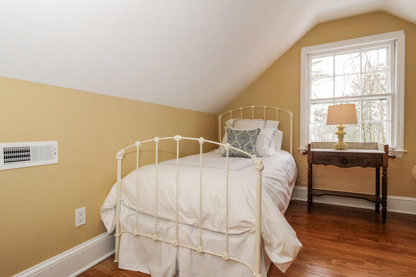 123 Brookside Road Darien, CT 06820 - Photo 23 of 39 a bedroom with a bed and a window