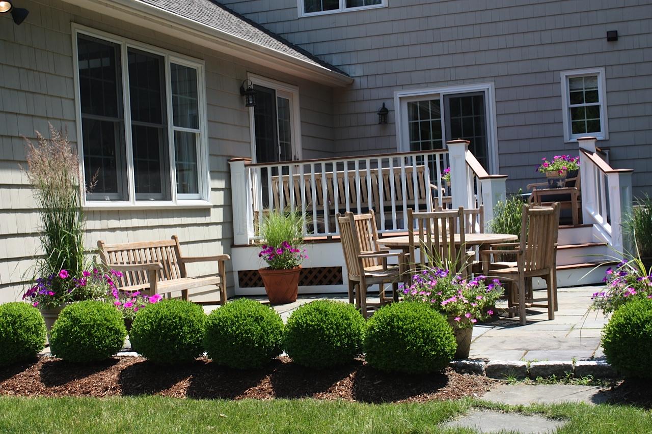 123 Brookside Road Darien, CT 06820 - Photo 34 of 39 a front view of a house with garden and plants