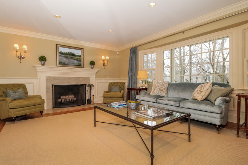 123 Brookside Road Darien, CT 06820 - Photo 5 of 39 a living room with furniture a large window and a fireplace