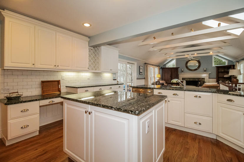 123 Brookside Road Darien, CT 06820 - Photo 7 of 39 a kitchen with granite countertop a sink and cabinets
