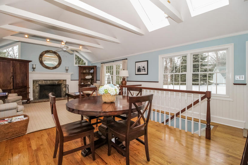 123 Brookside Road Darien, CT 06820 - Photo 8 of 39 a dining room with furniture a large window and wooden floor
