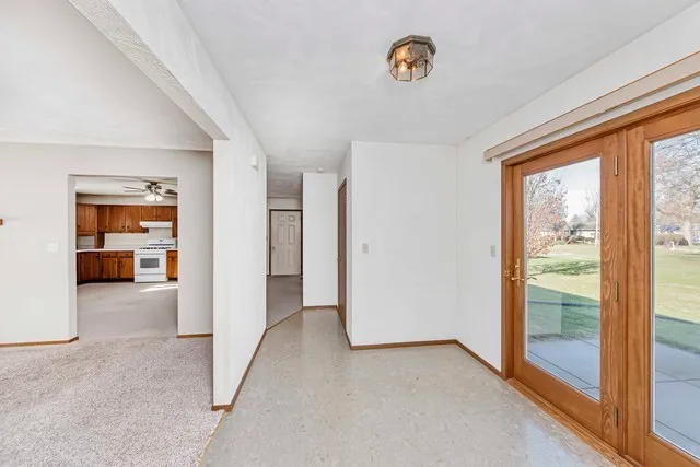 wooden floor in an empty room and a window