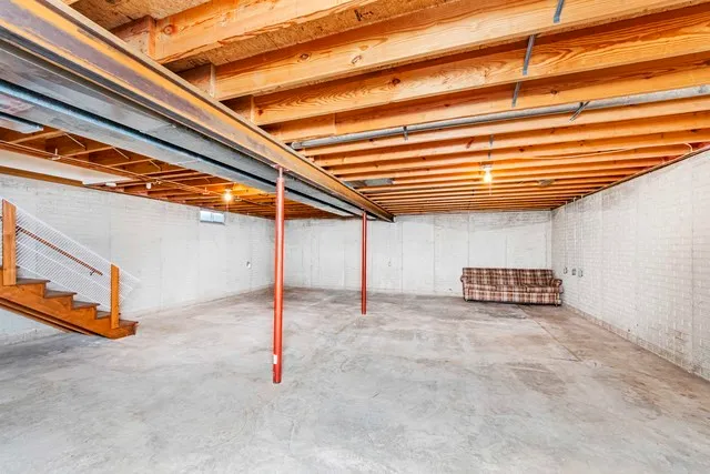 a view of a house with a big yard and large trees