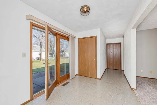 a view of an empty room and window