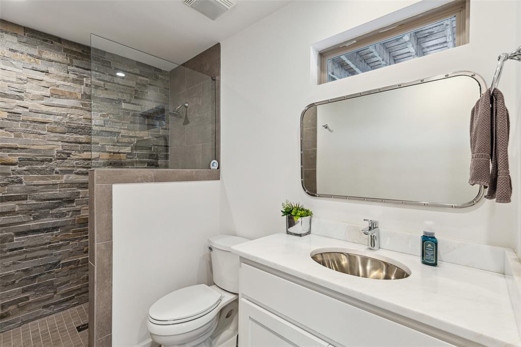 7342 Briar Road Azle, TX 76020 - Photo 23 of 40 Bathroom with tiled shower, toilet, and large vanity