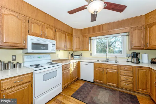 a bedroom with a bed dresser and a window