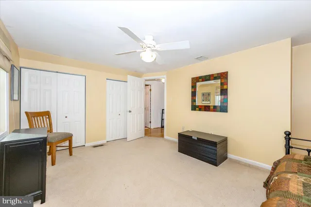a white toilet sitting next to a shower curtain