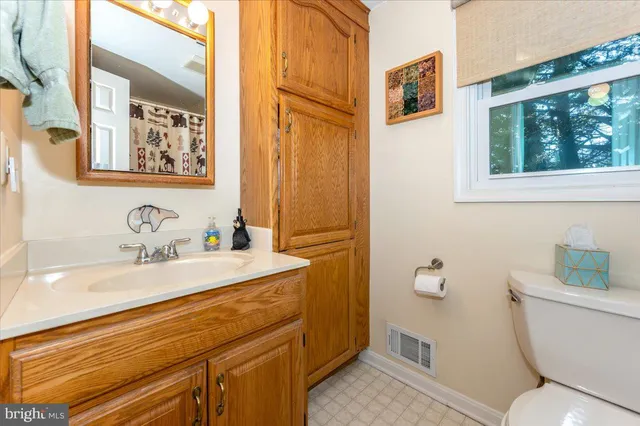 a view of a livingroom with furniture and a window