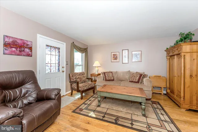 a living room with furniture and a rug